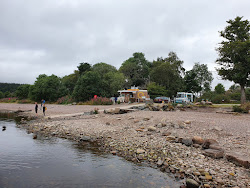 Foto van Dores Strand omringd door bergen