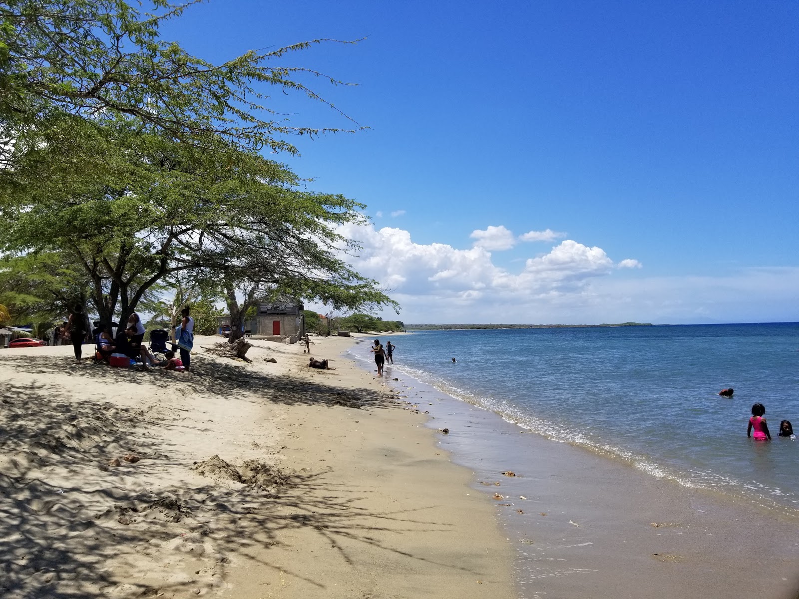 Fotografija Playa Los Coquitos z svetel pesek površino