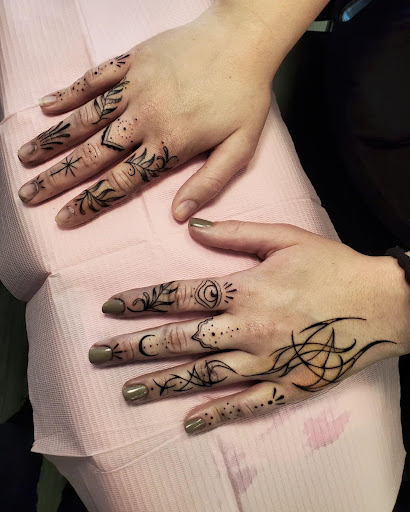 Explore footprints in the sand tattoo ideas, creative tattoo ideas in Palm Harbor, available at Angry Owl Tattoo and Piercing