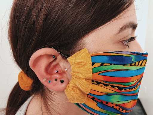 Find tattoos ideas for moms for your next unique tattoo in Champaign at Almost Famous Body Piercing