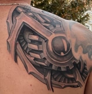 Explore leg tattoo ideas black male, creative tattoo ideas in Ocoee, available at Slaughterized Ink Tattoo and Piercing Studio