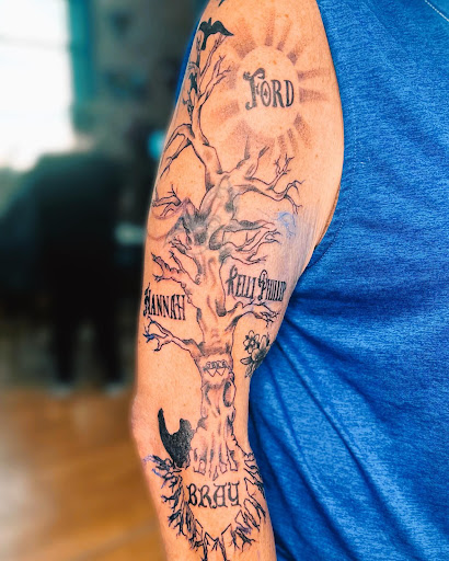 Explore lower back tattoo ideas for men, creative tattoo ideas in Belgrade, available at The Loyal Sparrow Tattoo and Piercing