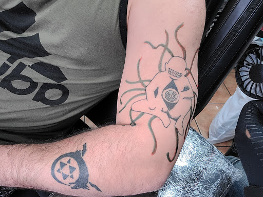 Explore middle neck tattoo ideas, creative tattoo ideas in Round Rock, available at Legacy Tattoos & Piercing