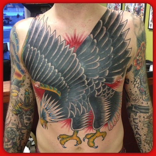 Explore thigh flower tattoo ideas, creative tattoo ideas in East Lansing, available at Splash of Color Tattoo & Piercing Studio