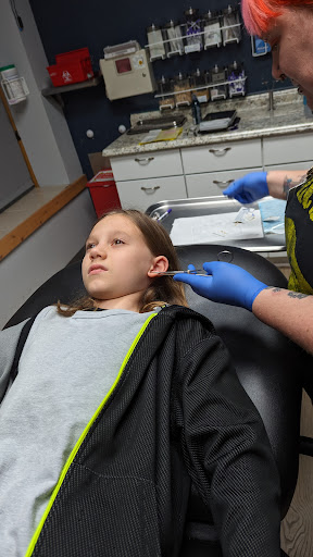 Explore dragonfly flower tattoo ideas, creative tattoo ideas in Milwaukee, available at Avant-Garde