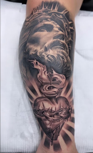 Explore cliff tattoo ideas, creative tattoo ideas in La Habra, available at Raining Ink Tattoo Studio