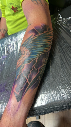 Explore back of the ear tattoo ideas, creative tattoo ideas in Jefferson, available at Slammin Ink Tattoo