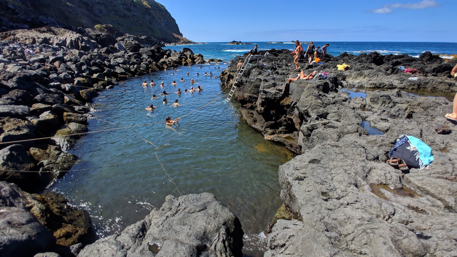 Photo of Ponta da Ferraria with rocks cover surface