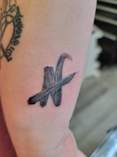 Explore heavy metal tattoo ideas, creative tattoo ideas in Columbus, available at Under the Gun Tattoo Studio
