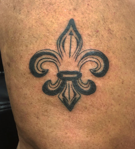 Explore lily flower tattoo ideas, creative tattoo ideas in Aledo, available at Elevated Tattoo & Piercing