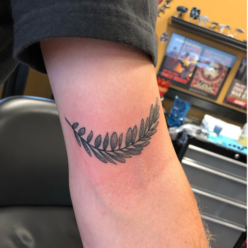 Explore leg tattoo cover up ideas for men, creative tattoo ideas in Lees Summit, available at Bleeding Heart Tattoo