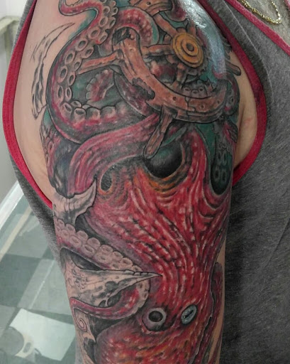Explore small dragon tattoo ideas, creative tattoo ideas in Lewiston, available at Altered Image Tattoo Studio