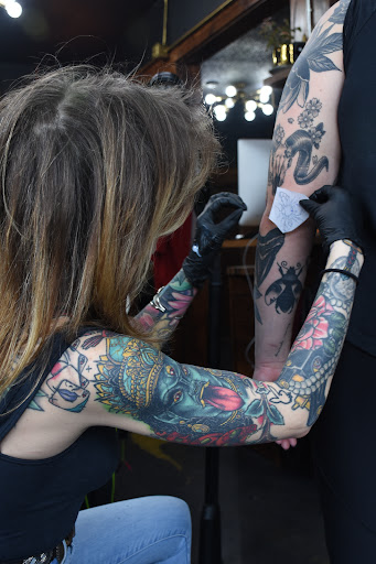 Find guardian tattoo ideas for your next unique tattoo in Des Moines at Black Magic Tattoo