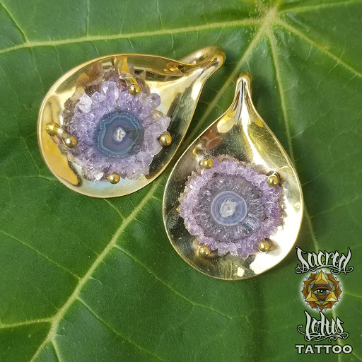 Explore half leg sleeve tattoo ideas, creative tattoo ideas in Asheville, available at Sacred Lotus Tattoo