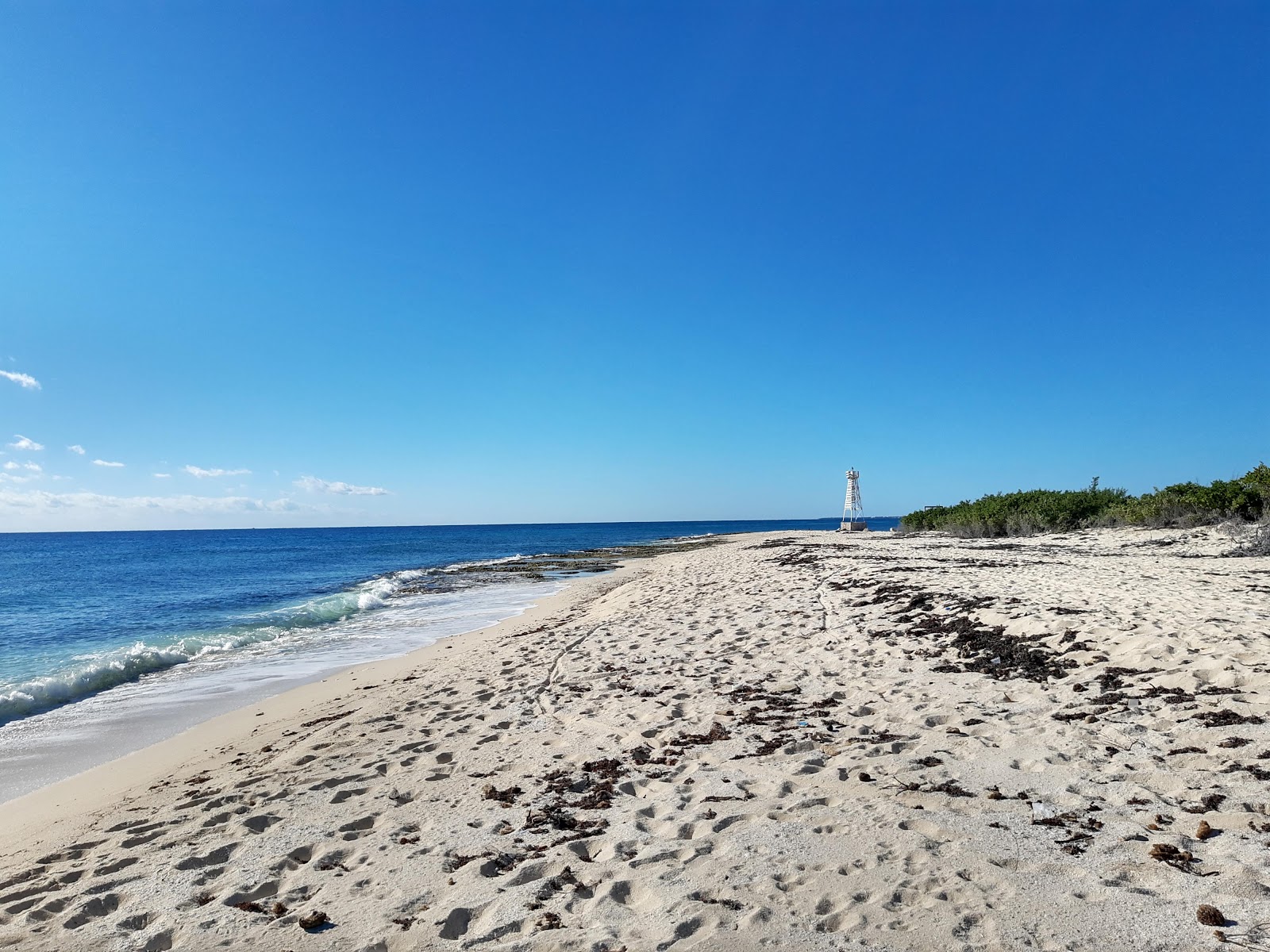Fotografie cu Playa Punta Brava cu o suprafață de nisip strălucitor și pietre