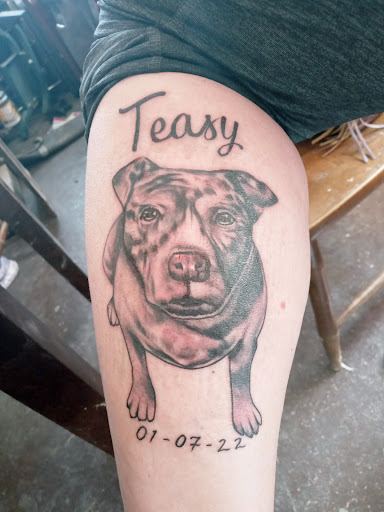 Explore black power tattoo ideas, creative tattoo ideas in Macomb, available at Lincoln Tattoo