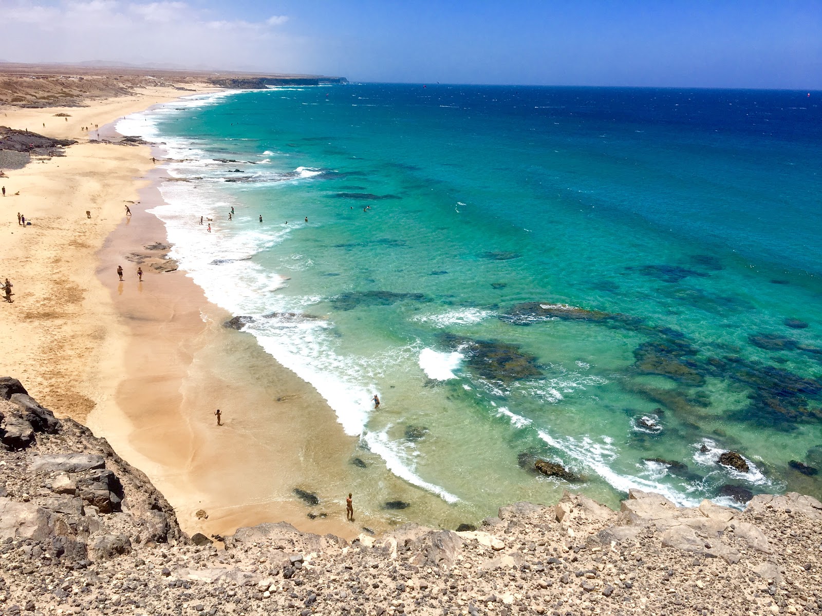 Foto di Playa del Castillo con una superficie del sabbia beige fine