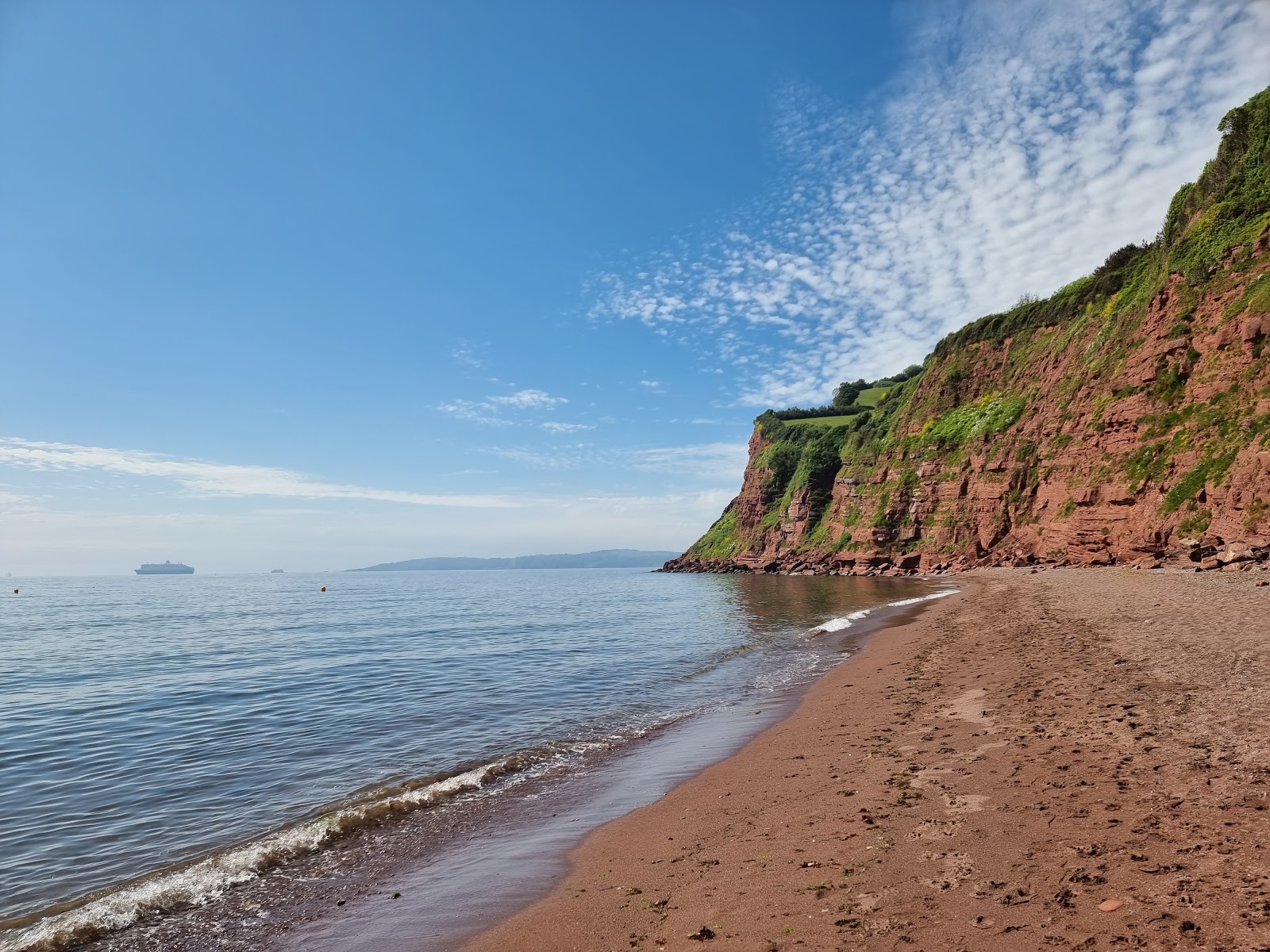 Foto van Ness Cove beach met bruin zand oppervlakte