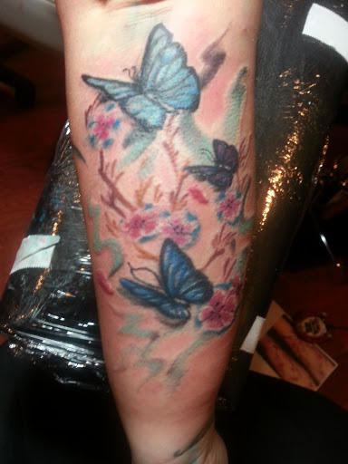 Explore punk tattoo ideas, creative tattoo ideas in Newport, available at Mutiny Tattoo Co. LLC