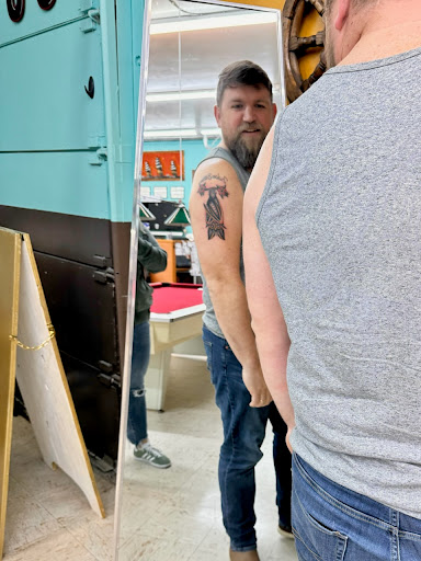 Explore leg tattoo ideas black male, creative tattoo ideas in Everett, available at Sunken Ship Tattoos