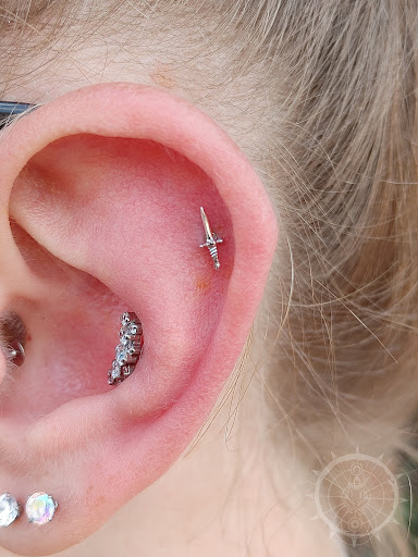 Explore tattoo ideas behind the ear, creative tattoo ideas in Eau Claire, available at Steel N Ink Body Piercing