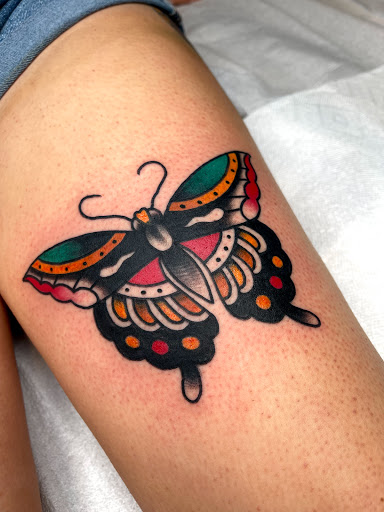 Explore bikini tattoo ideas, creative tattoo ideas in Johnson City, available at Gold Cross Tattoo Co.