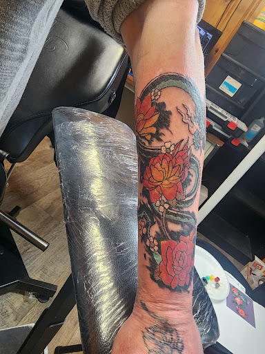 Explore black couple tattoo ideas, creative tattoo ideas in Charlottesville, available at ScottyrocksTwisted Inks