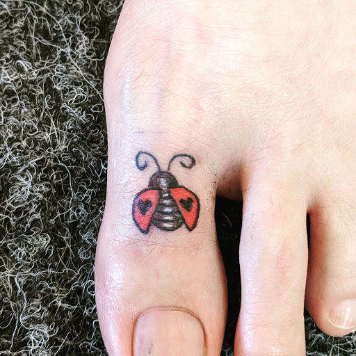 Find dino tattoo ideas for your next unique tattoo in Redding at Caddy Daddys