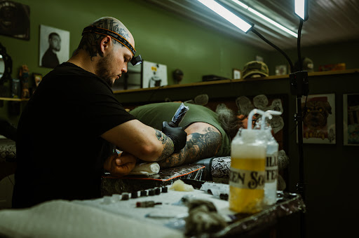 Explore ribbon tattoo ideas, creative tattoo ideas in Stanton, available at Eclectic Art & Tattoo