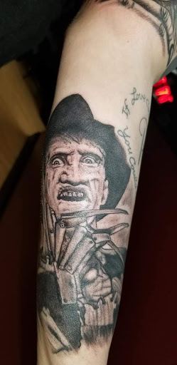 Explore rock climbing tattoo ideas, creative tattoo ideas in Cheltenham, available at Louder Than Bombs Tattoo