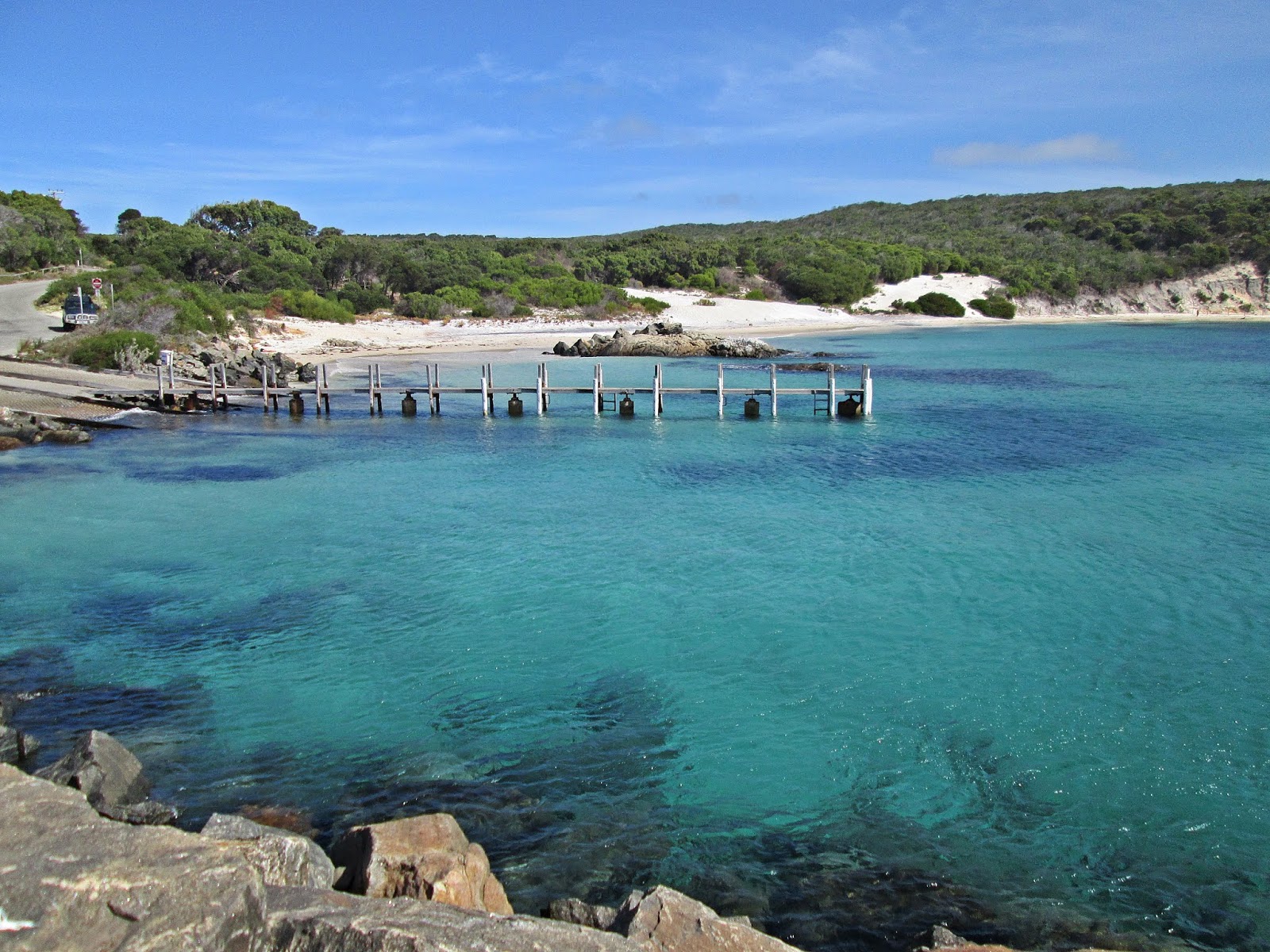 Foto von Fishery Beach mit beiger sand Oberfläche