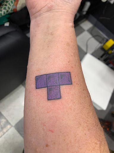 Explore hood tattoo ideas, creative tattoo ideas in Virginia Beach, available at Salt Water Tattoo