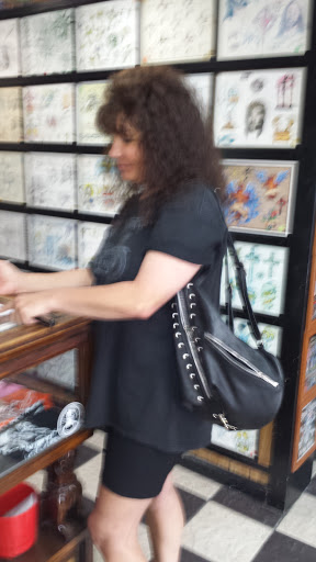 Explore grumpy bear tattoo ideas, creative tattoo ideas in Ormond Beach, available at Tropical Tattoo Inc