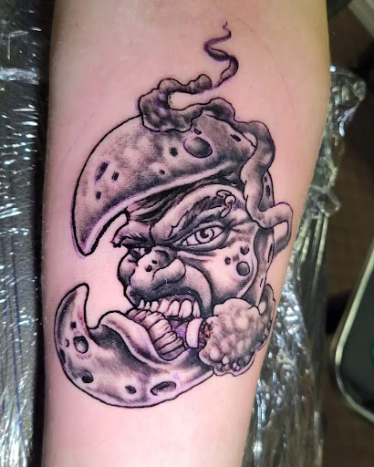 Explore light bulb tattoo ideas, creative tattoo ideas in Angola, available at Hoodlum Ink