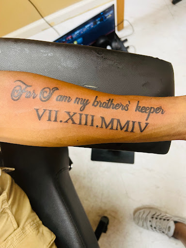 Explore rock tattoo ideas, creative tattoo ideas in Warner Robins, available at Pen & Portrait Tattoos