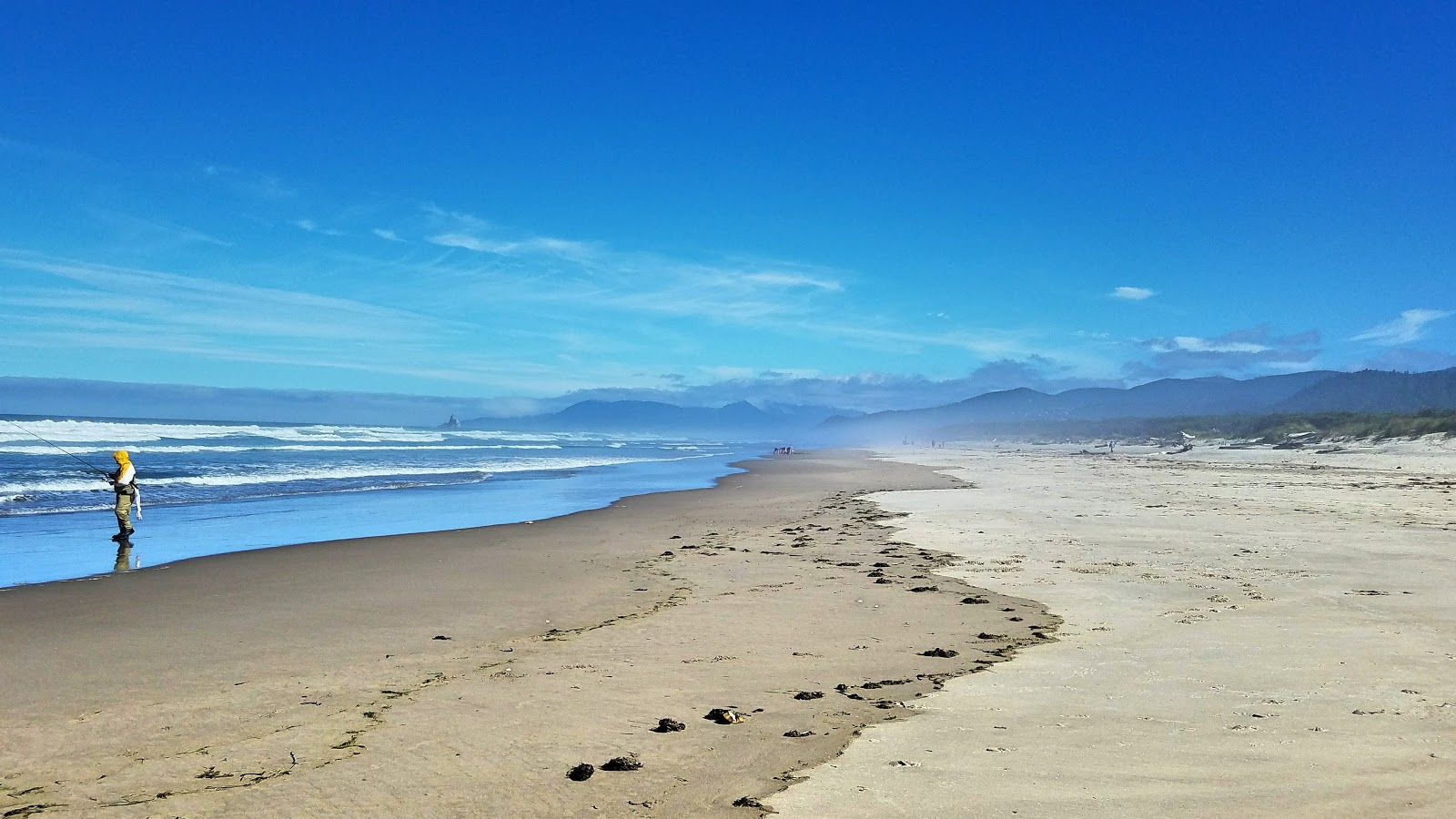 Photo of Tillamook County Beach with turquoise pure water surface