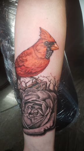 Explore purple flower tattoo ideas, creative tattoo ideas in Lagrangeville, available at Black Cherry Tattoo Studio NY