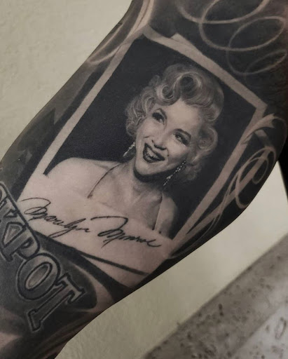 Explore scroll tattoo ideas, creative tattoo ideas in Hollywood, available at Sacred Eye Tattoos