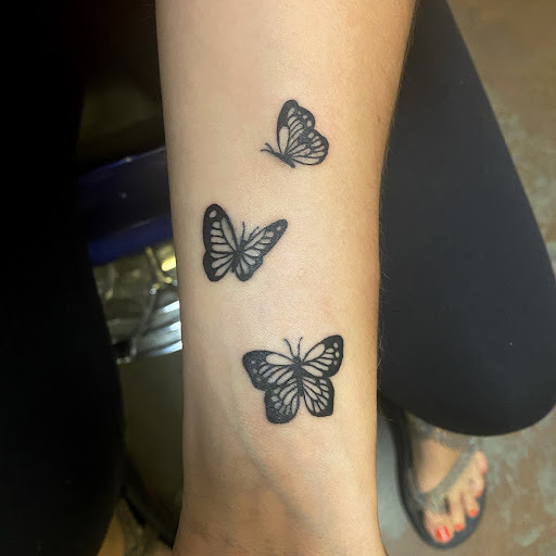 Explore flower leg tattoo ideas, creative tattoo ideas in Durango, available at Headhunter Tattoo