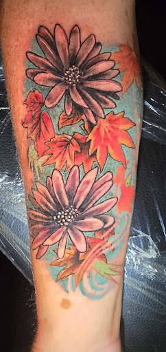 Explore tattoo ideas for men's shoulders, creative tattoo ideas in Angola, available at Hoodlum Ink