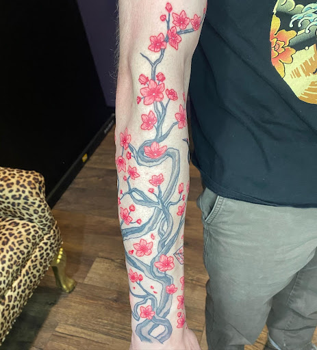 Explore emperor's new groove tattoo ideas, creative tattoo ideas in Warner Robins, available at Untold Pain Tattoo Studio