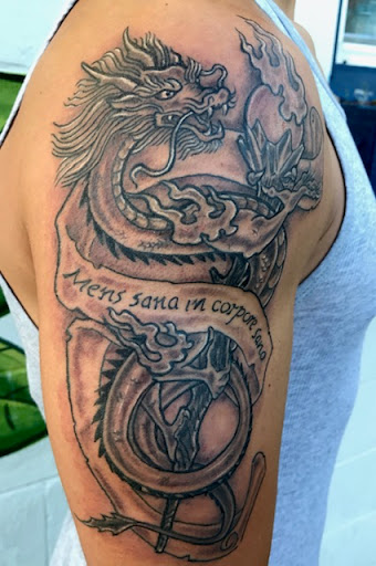 Explore cross tattoo ideas forearm, creative tattoo ideas in Olympia, available at Primeval Ink Tattoo