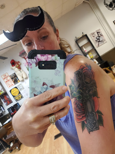 Explore cover up tattoo ideas on arm, creative tattoo ideas in Le Roy, available at Blood Money Ink