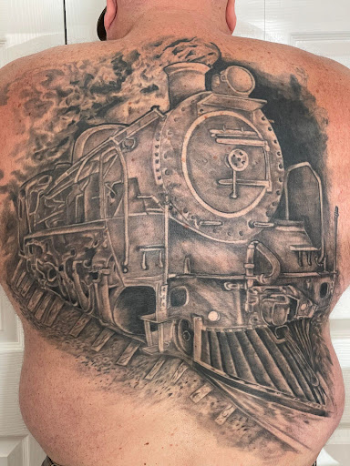 Explore snake tattoo ideas for females, creative tattoo ideas in Debary, available at Divine Line Tattoos