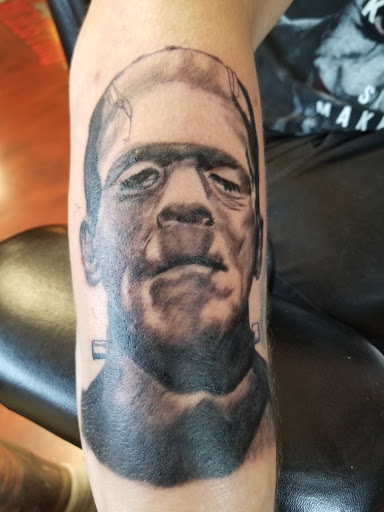 Explore cross tattoo ideas for men, creative tattoo ideas in Cincinnati, available at Bullseye Ink Tattoos & Piercing