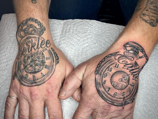 Explore wedding band tattoo ideas for him, creative tattoo ideas in Lakeview, available at Backwoods Tattoo Studio