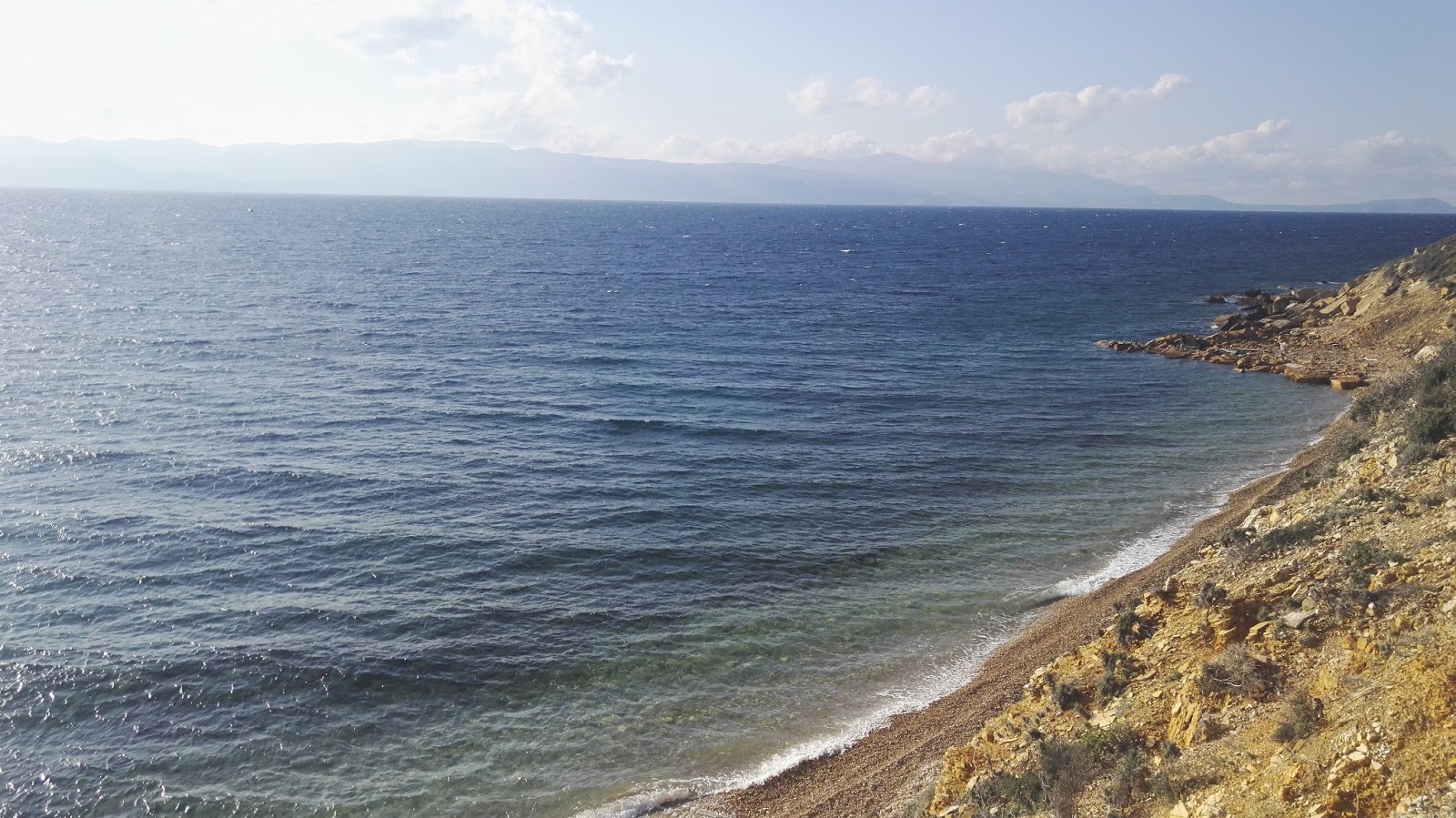 Sağlık Plajı VI'in fotoğrafı düz bir kıyı şeridi ile birlikte