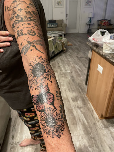 Explore tribal half sleeve tattoo ideas, creative tattoo ideas in Foley, available at Symbolic Ink Tattoo Studio