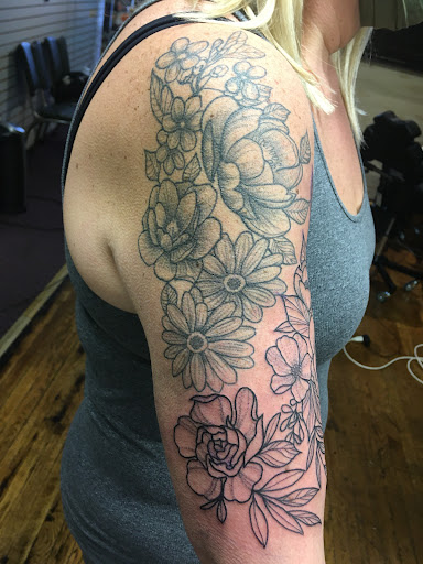 Explore easy flower tattoo ideas, creative tattoo ideas in Eureka Springs, available at Sailors Luck Tattoo
