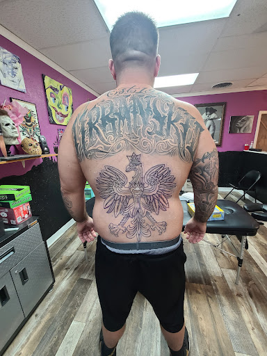 Explore snoopy tattoo ideas, creative tattoo ideas in Toledo, available at Exclusive Tattoo